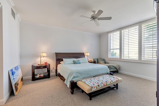 carpeted bedroom featuring ornamental molding, visible vents, ceiling fan, and baseboards