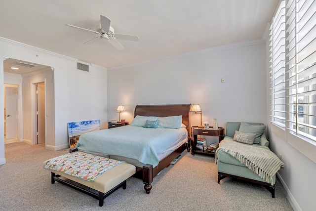 carpeted bedroom with crown molding, visible vents, baseboards, and ceiling fan
