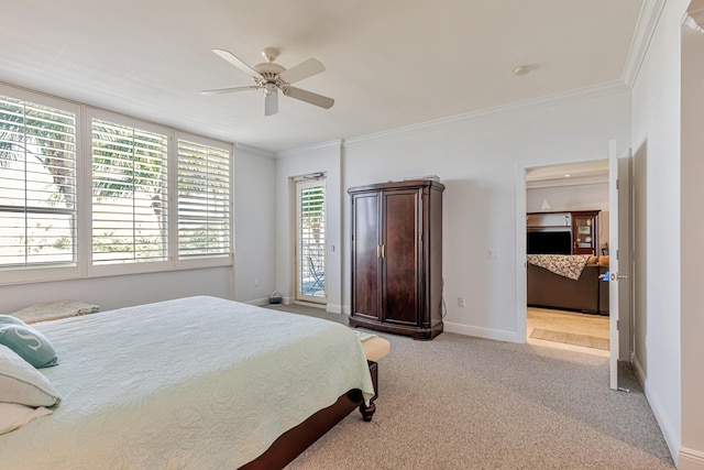 bedroom featuring crown molding, light carpet, baseboards, and ceiling fan