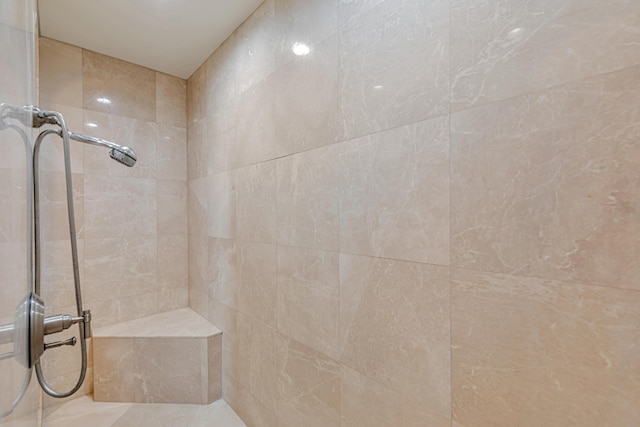 bathroom featuring tiled shower