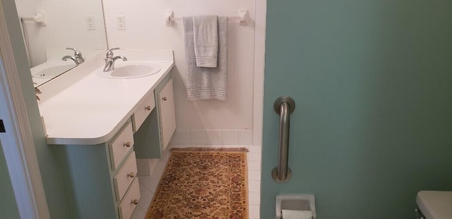 bathroom with toilet and vanity