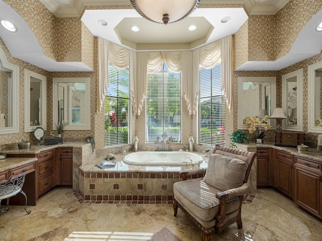 bathroom featuring wallpapered walls, crown molding, a bath, and vanity