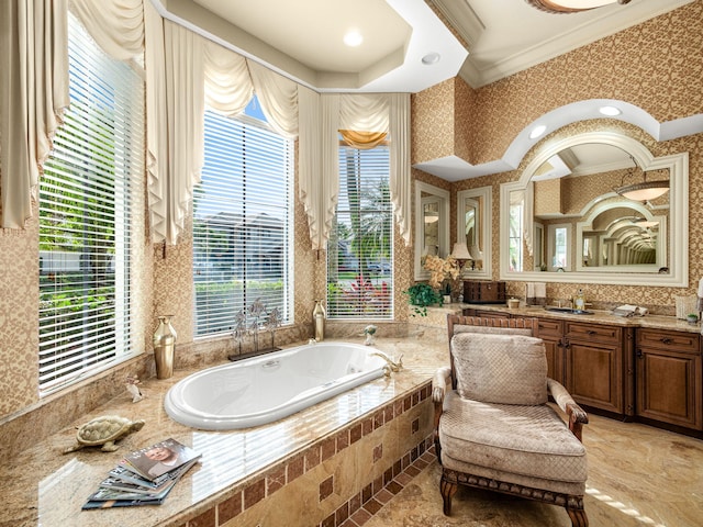 full bathroom featuring wallpapered walls, a garden tub, vanity, and crown molding