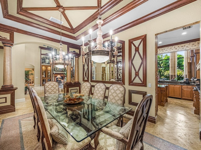 dining space featuring arched walkways, a tray ceiling, crown molding, decorative columns, and visible vents