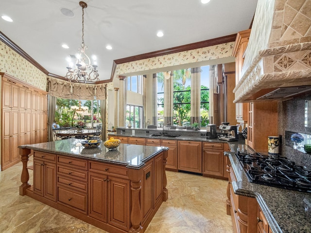 kitchen with wallpapered walls, brown cabinets, marble finish floor, crown molding, and premium range hood