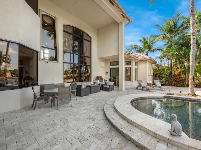 exterior space with outdoor lounge area and a patio