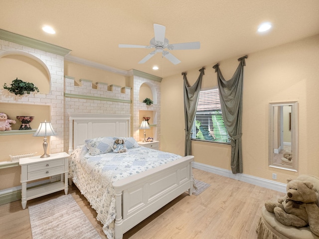 bedroom with ceiling fan, light wood finished floors, recessed lighting, and baseboards