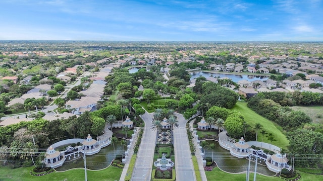 birds eye view of property with a water view and a residential view