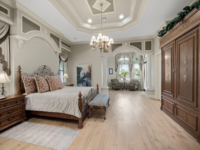 bedroom with visible vents, arched walkways, a raised ceiling, light wood-style flooring, and ornate columns