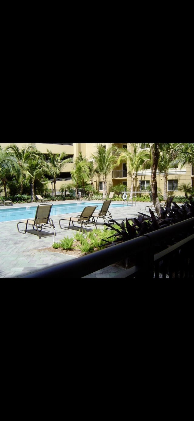 community pool with a patio area