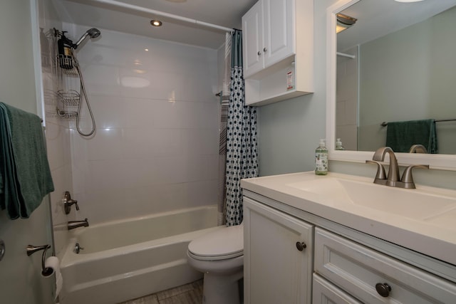 bathroom featuring vanity, shower / bath combo with shower curtain, and toilet