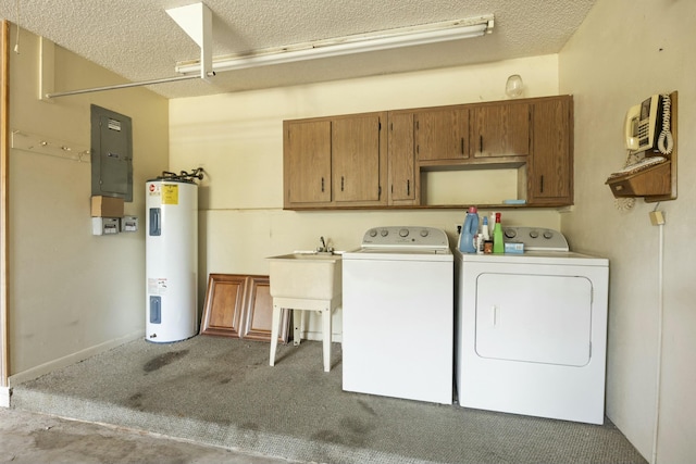 laundry area featuring a textured ceiling, electric water heater, cabinet space, electric panel, and washing machine and clothes dryer