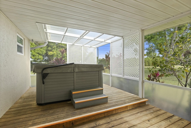 deck with a hot tub