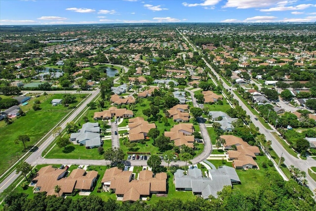 birds eye view of property with a residential view