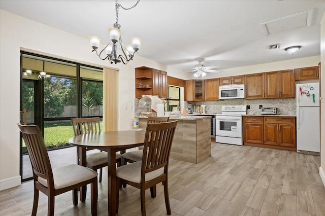 kitchen featuring white appliances, light wood-type flooring, backsplash, brown cabinets, and open shelves