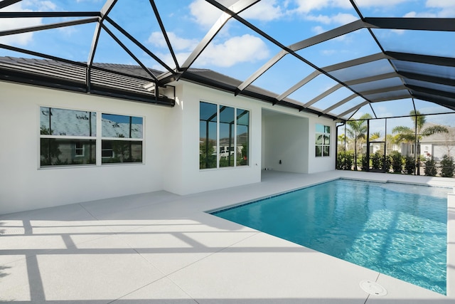 pool featuring a lanai and a patio area