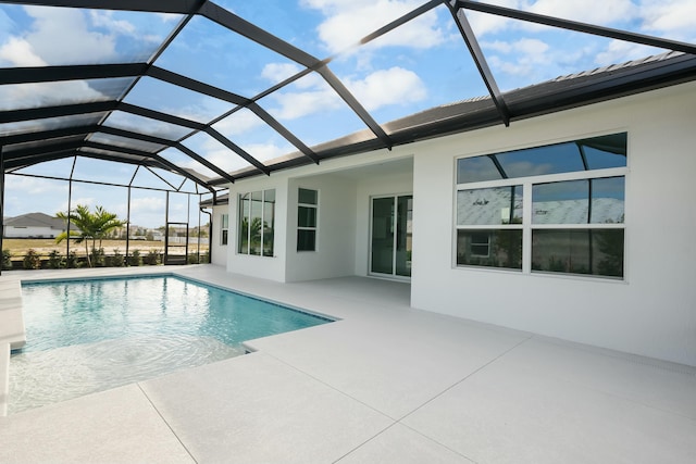 pool featuring a lanai and a patio area