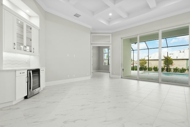 interior space featuring marble finish floor, visible vents, beverage cooler, coffered ceiling, and baseboards