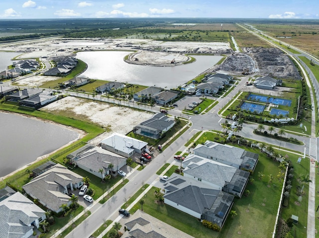 bird's eye view with a water view and a residential view