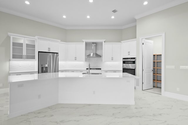 kitchen with tasteful backsplash, visible vents, a spacious island, appliances with stainless steel finishes, and wall chimney range hood