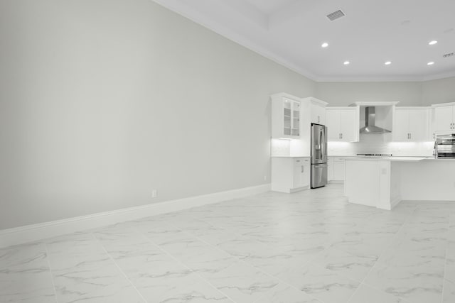 kitchen featuring marble finish floor, wall chimney exhaust hood, stainless steel appliances, open floor plan, and baseboards