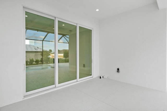 spare room with recessed lighting and a sunroom