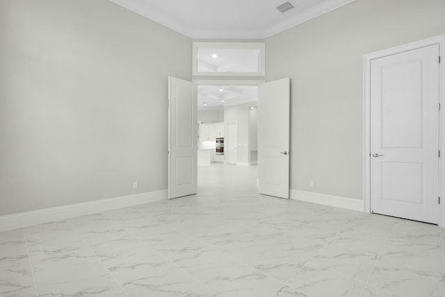 unfurnished bedroom featuring marble finish floor, visible vents, and crown molding