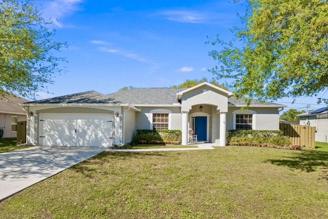 view of front facade featuring a front lawn, roof with shingles, stucco siding, a garage, and driveway