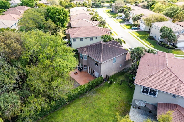 birds eye view of property with a residential view