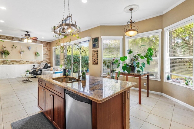 kitchen featuring a sink, crown molding, pendant lighting, and dishwasher