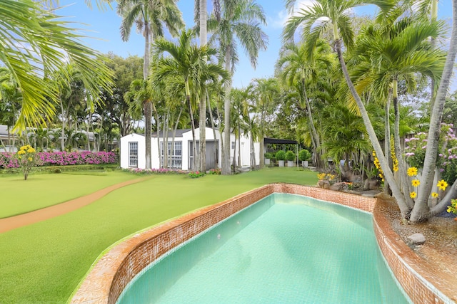 view of pool with an outdoor structure