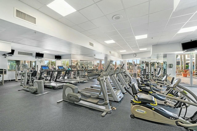 workout area with a paneled ceiling and visible vents