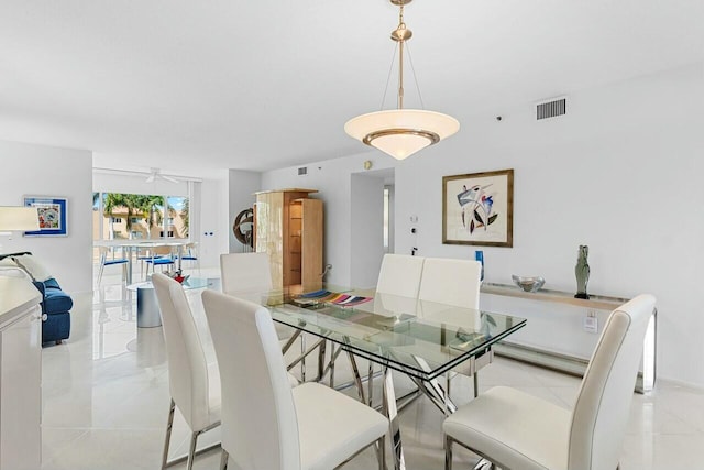 dining room featuring a ceiling fan and visible vents