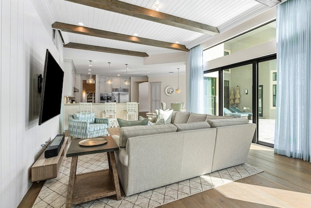 living room with wood ceiling, beamed ceiling, and light wood-style flooring