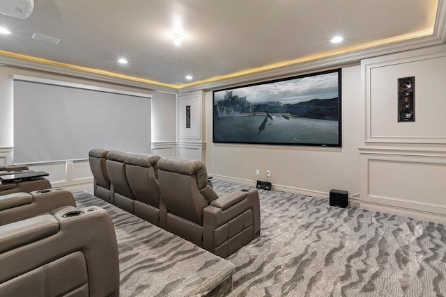 carpeted cinema room featuring crown molding, recessed lighting, and a decorative wall