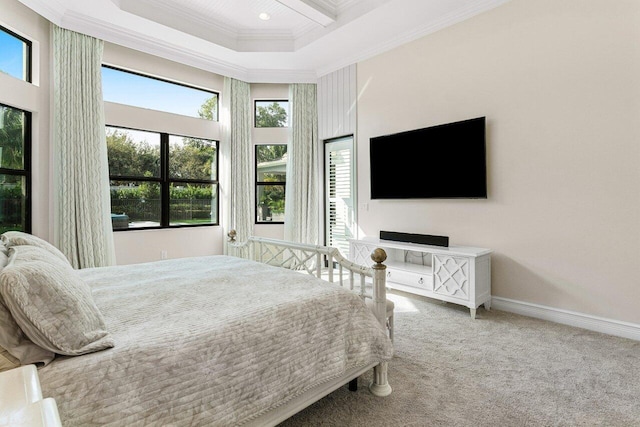 carpeted bedroom featuring a high ceiling, baseboards, and crown molding