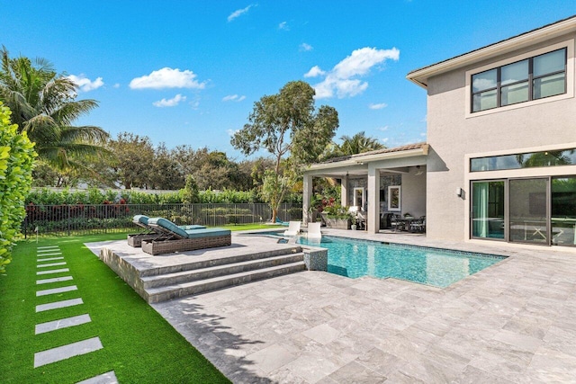 view of pool with a patio, fence, and a fenced in pool