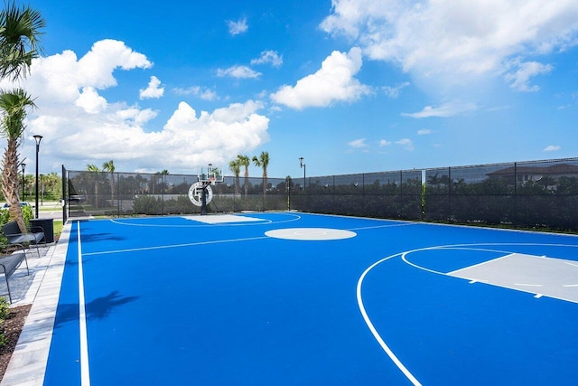 view of sport court featuring community basketball court and fence