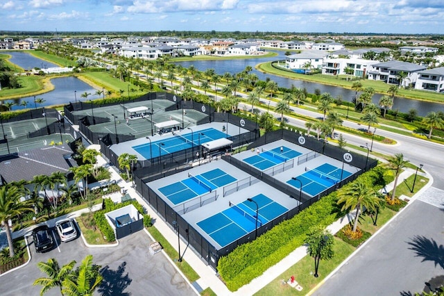 bird's eye view with a water view and a residential view