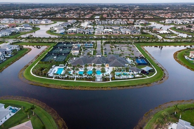 birds eye view of property featuring a water view and a residential view