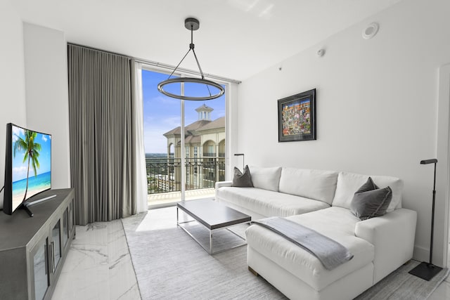 living room featuring marble finish floor and floor to ceiling windows