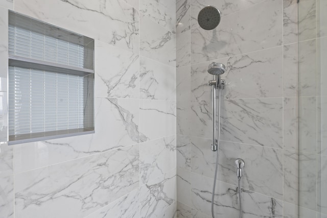 full bath featuring a marble finish shower