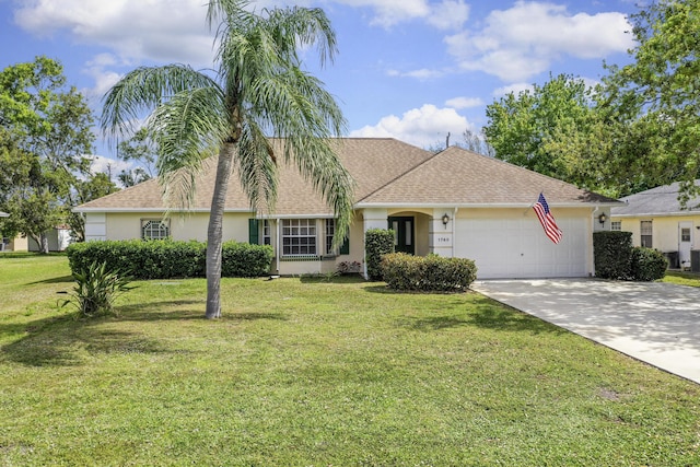 ranch-style house with a garage, concrete driveway, stucco siding, roof with shingles, and a front yard