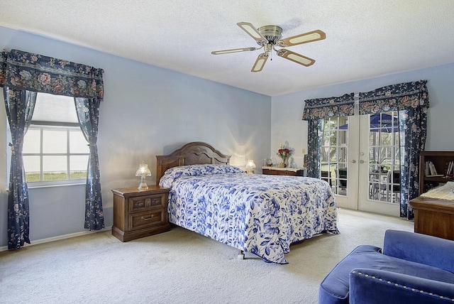 carpeted bedroom with access to exterior, french doors, a ceiling fan, a textured ceiling, and baseboards