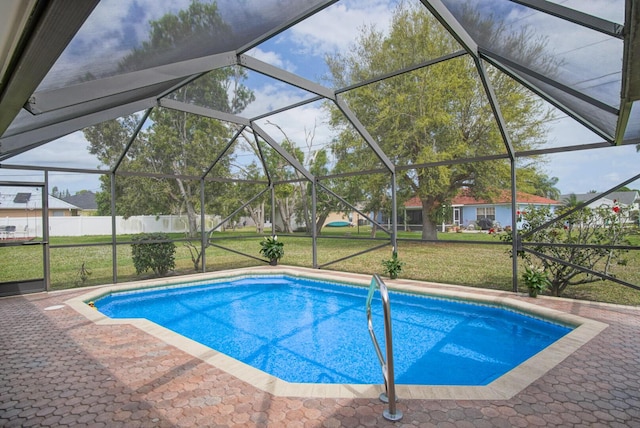 outdoor pool with glass enclosure, a yard, and fence