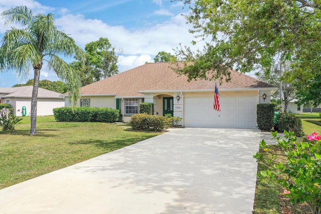 ranch-style home with a garage, driveway, a front lawn, and stucco siding