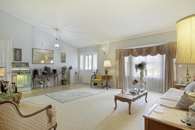 living room featuring lofted ceiling, a textured ceiling, and light colored carpet