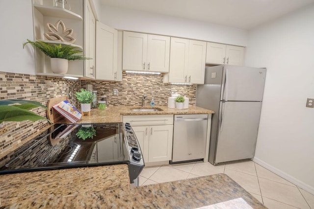 9785 Pineapple Tree Dr Unit 103, Boynton Beach, FL 33436 - kitchen featuring freestanding refrigerator, dishwasher, open shelves, black electric range oven, and light tile patterned floors