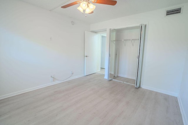 9785 Pineapple Tree Dr Unit 103, Boynton Beach, FL 33436 - unfurnished bedroom with light wood finished floors, a closet, and ceiling fan