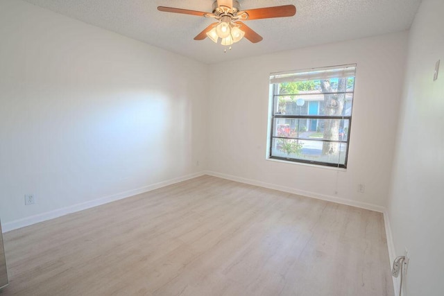 9785 Pineapple Tree Dr Unit 103, Boynton Beach, FL 33436 - unfurnished room with wood finished floors, a textured ceiling, and a ceiling fan